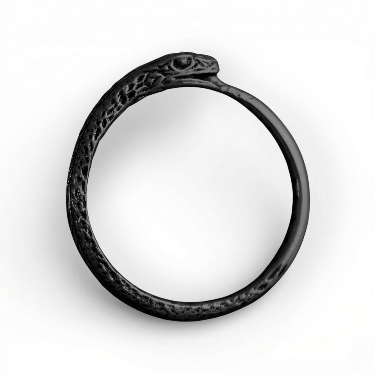Black silver ring with intricate design on a white background