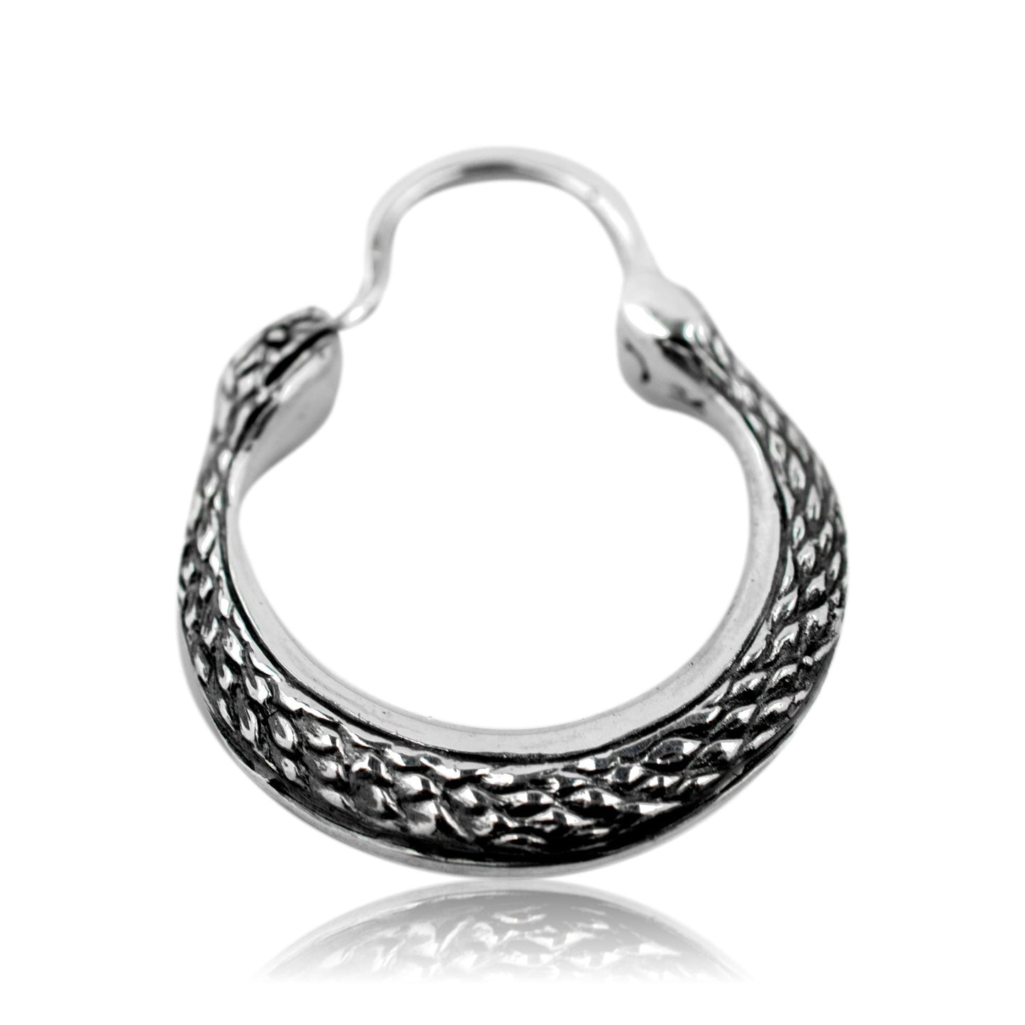 Silver hoop earring with intricate design on a white background